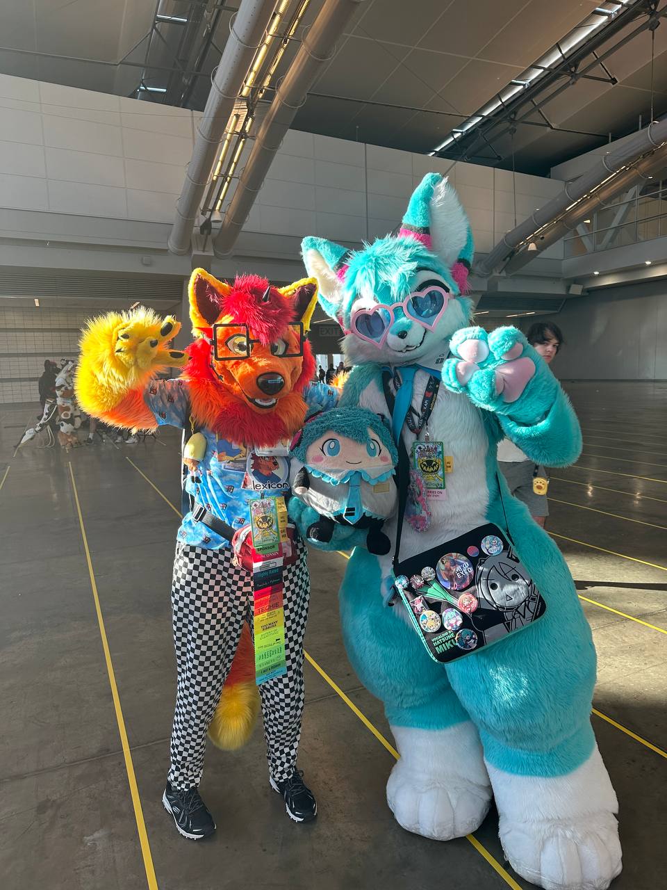 Lexicon and Roflfox (Hatsune Miku-inspired fox fursuiter) posing in the DLCC Hall C